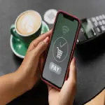 person-paying-using-nfc-technology_23-2149893722